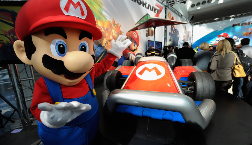 LOS ANGELES, CA - NOVEMBER 17: Nintendo game character Mario stands next to the new gamer-themed car built by West Coast Customs on November 17, 2011 in Los Angeles, California. The car show opens to the public tomorrow and runs through November 27. (Photo by Kevork Djansezian/Getty Images)